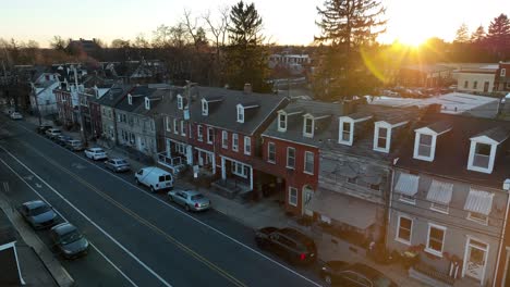 slow aerial pass by row houses in american city