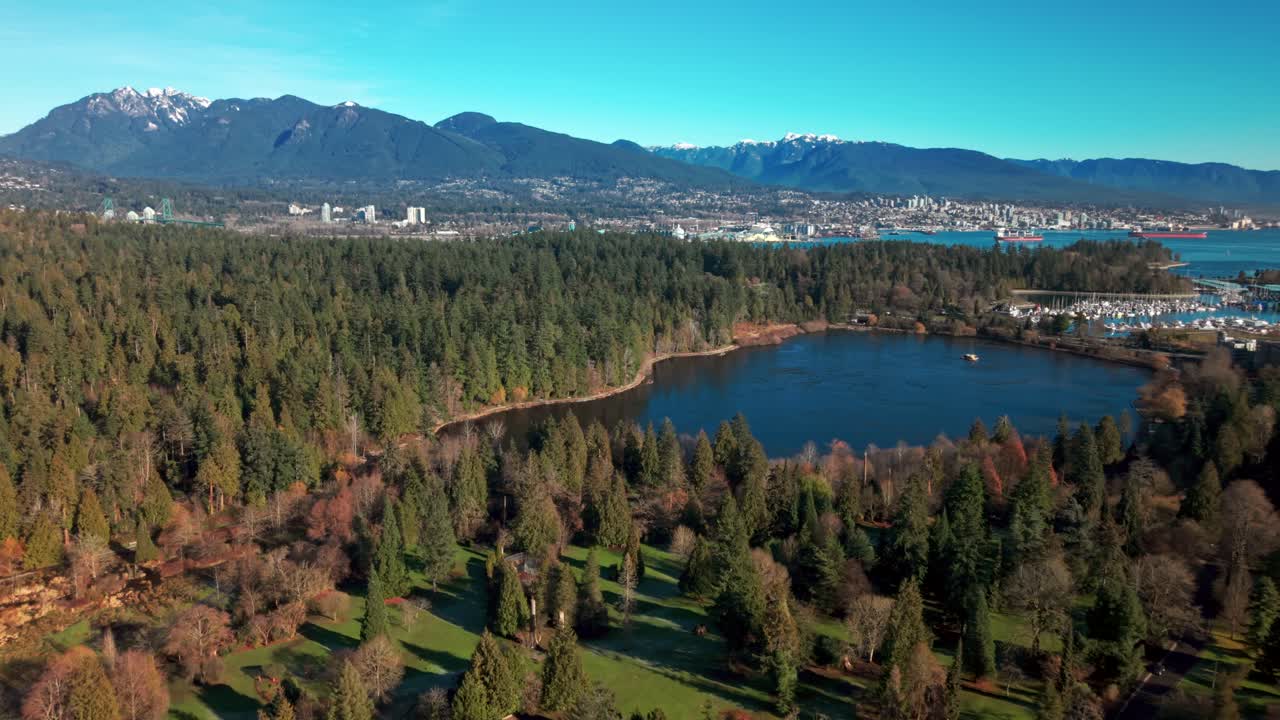 Stunning drone footage showcasing Stanley Park and downtown Vancouver in 4K, capturing lush greenery, city skyline, and waterfront scenery from above.