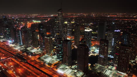 forwards fly above modern city at night