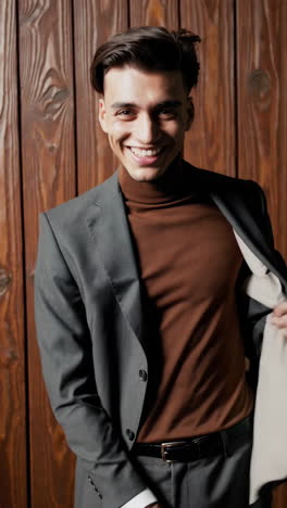 smiling young man in a stylish suit and turtleneck