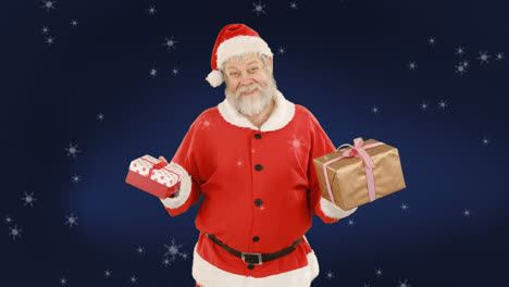 animation of santa claus holding presents with snow falling over blue background