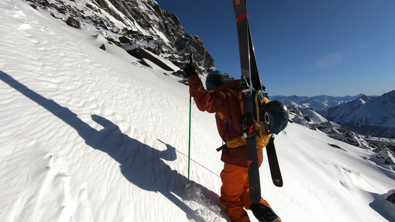 professional mountaineer cliping mountain peak in Tirol. Beautiful landscape 60 frames.Top freeride gear steady filming #slomotion.