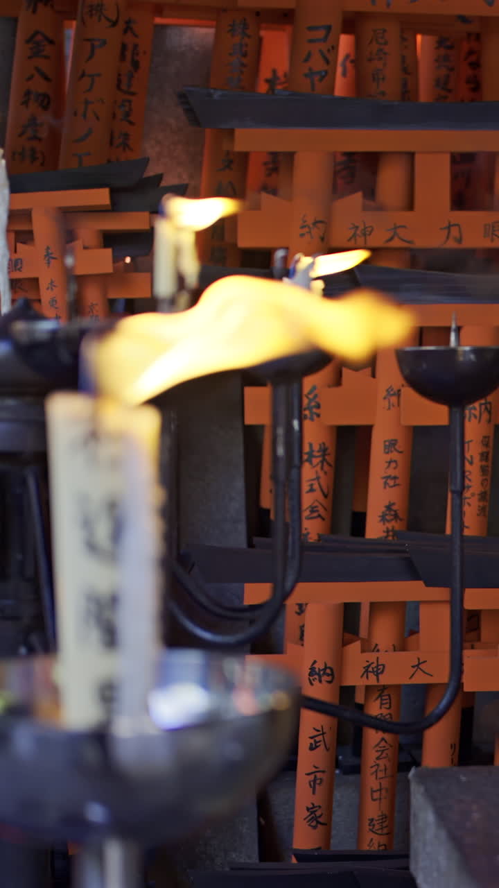 Explore the vibrant beauty of Fushimi Inari in Kyoto, Japan with glowing candles and rich history at a sacred shrine