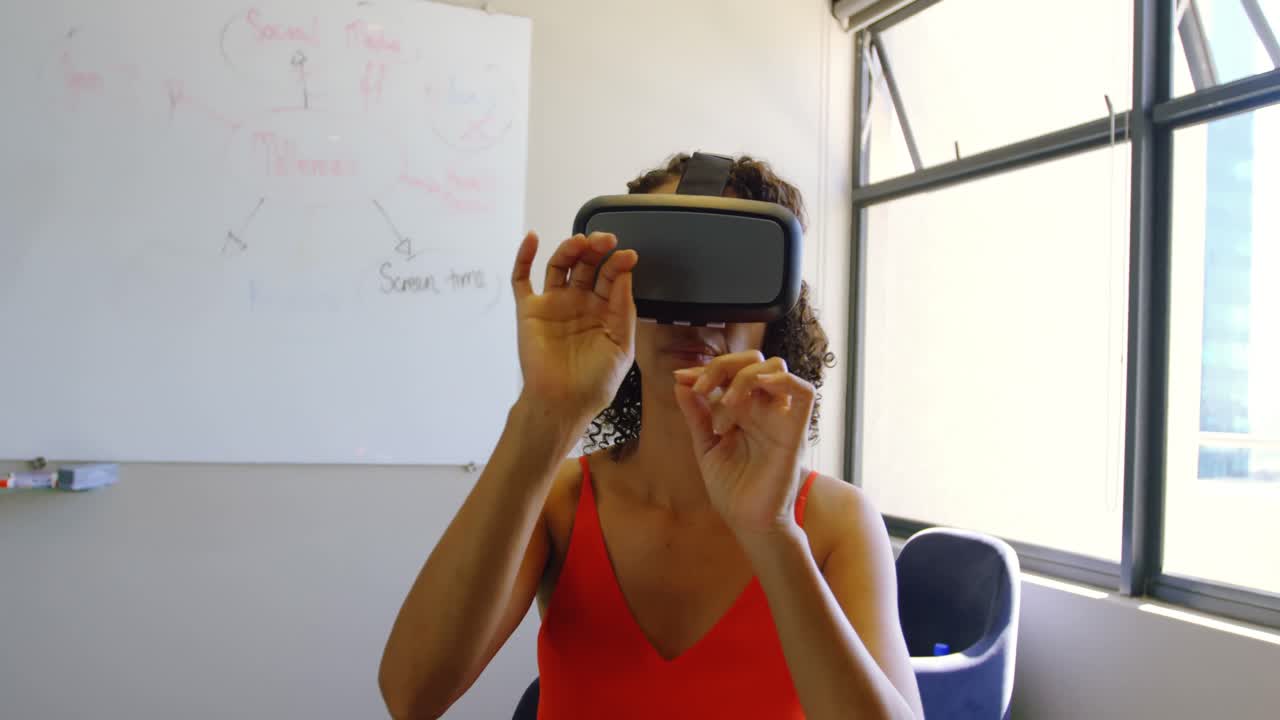 Female executive using virtual reality headset 4k
