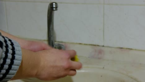 man washing dishes