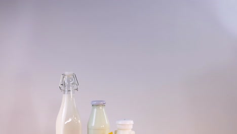 assorted dairy items arranged on a wooden surface