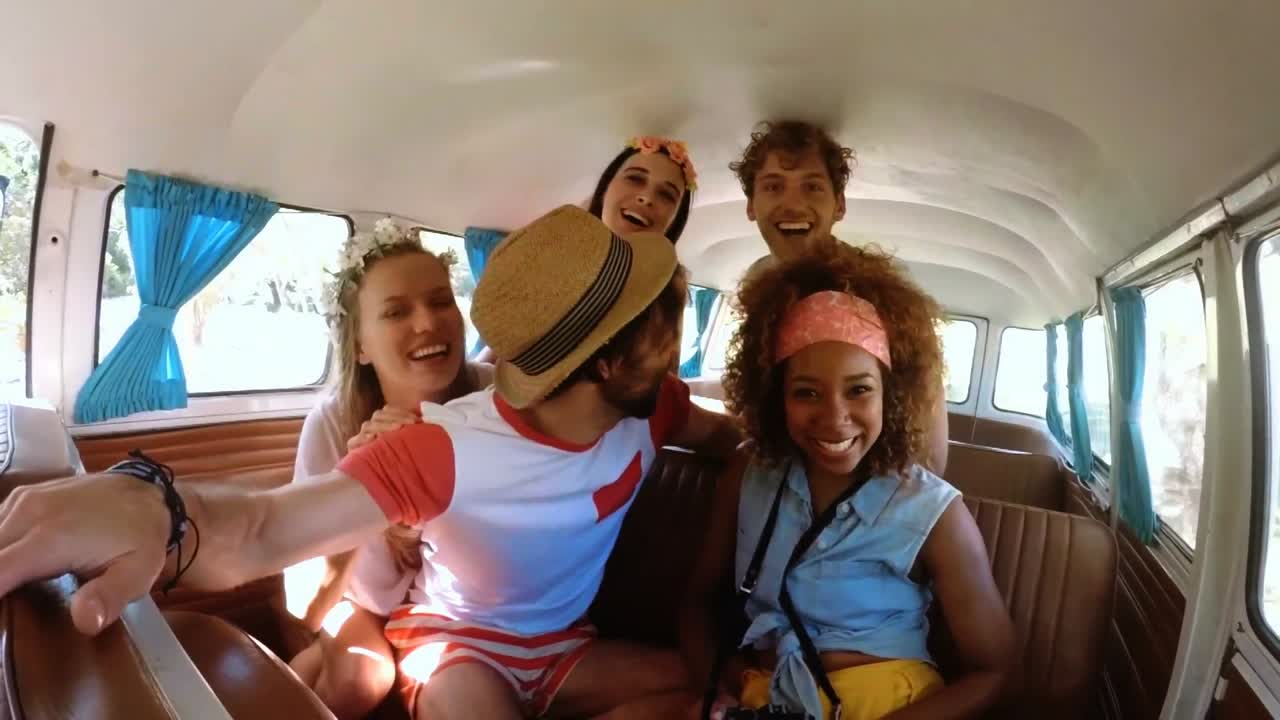 Hipster friends having fun in camper van