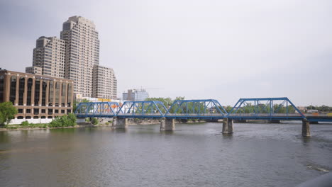 Wide-shot-of-the-Grand-river-flowing-through-downtown-Grand-Rapids