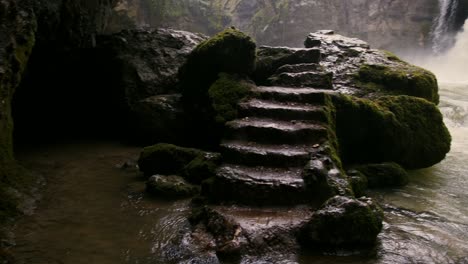 massive waterfall in a rocky circle creating wonderful and powerful place