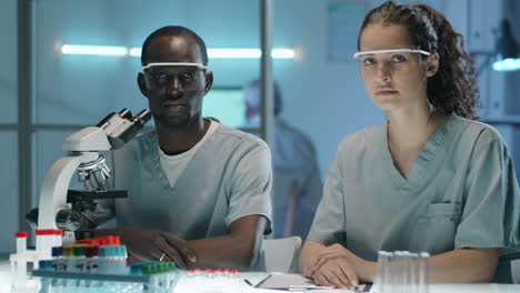 portrait of multiethnic male and female scientists in lab