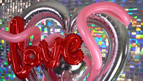 valentine balloon decoration with glittering wall background for party.