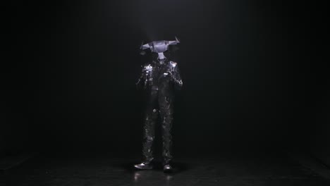 abstract dance performance in metallic costume