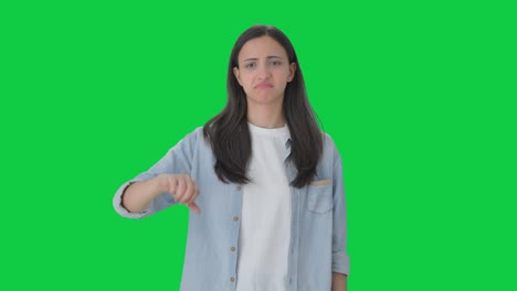 Upset-Indian-girl-showing-thumbs-down-Green-screen