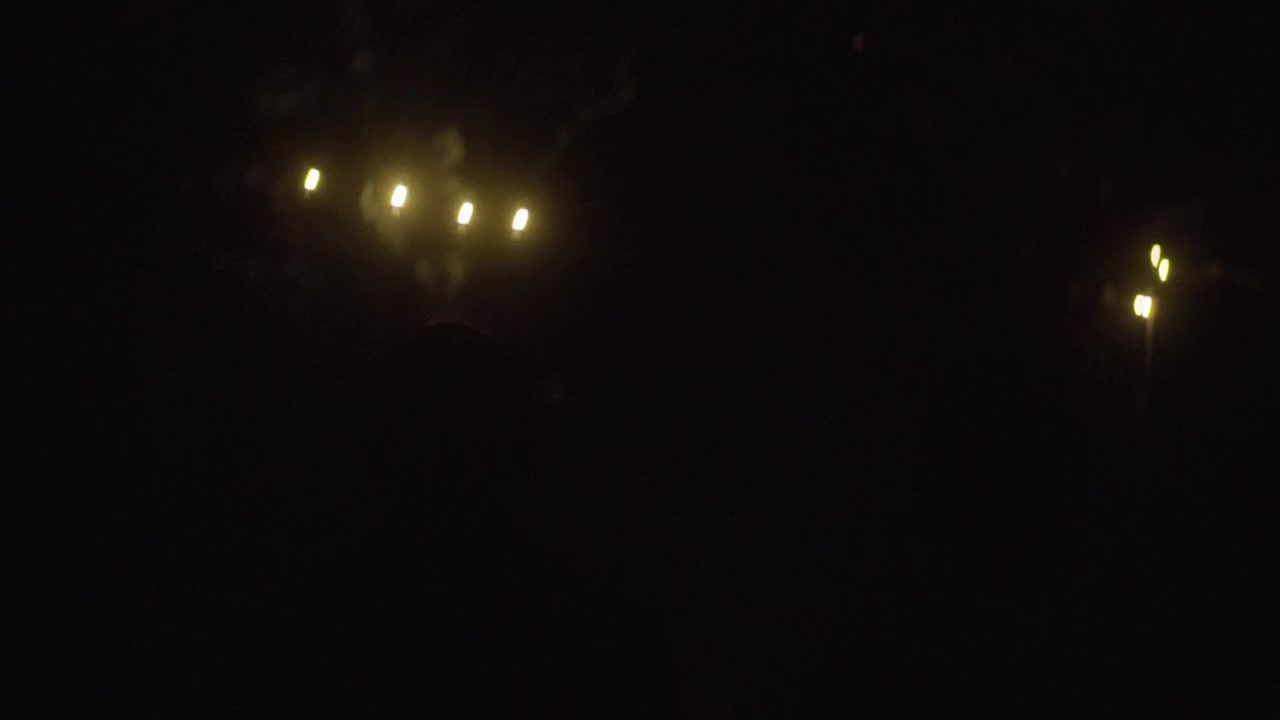 two men in front of a firework in slowmotion