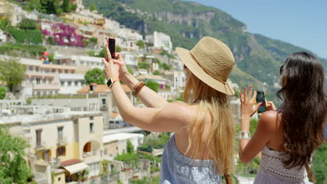 two friends taking photos of the view using