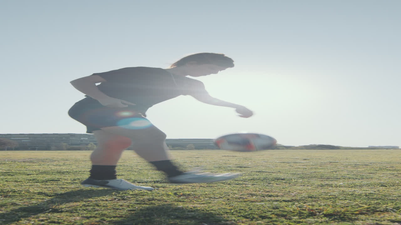 Sportswoman Juggling Soccer Ball on Sunny Day
