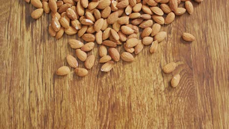 video of almonds on wooden background