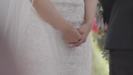 brides hands shaking during wedding ceremony