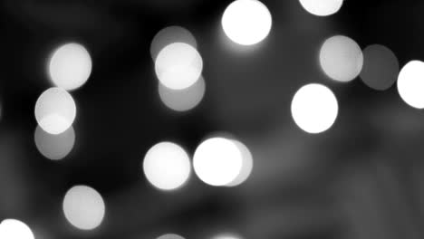 luces blancas y negras borrosas. desfocado brillante bokeh fondo festivo. luz abstracta.