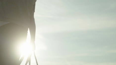 person walking outdoors in sunlight