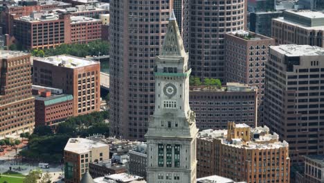 drone shot of boston's custom house tower amid the city landscape