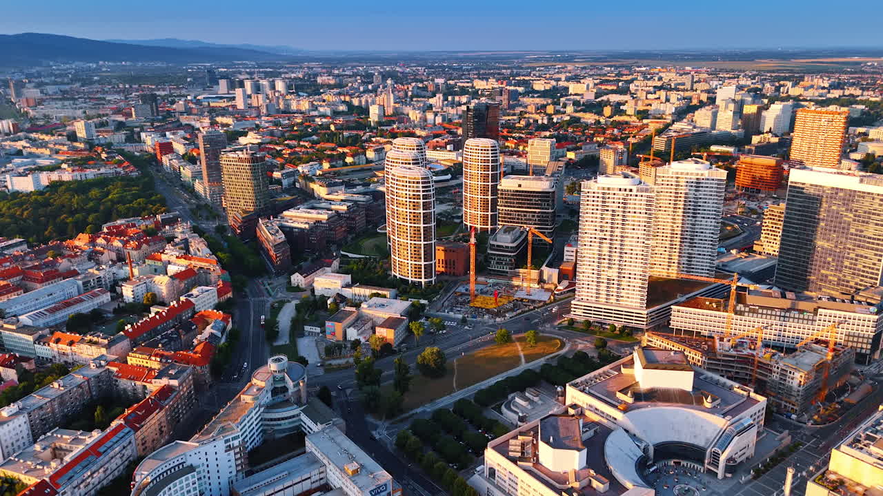Bright sun reflects on the facades of the high-rises. Footage above the modern part of Bratislava, Slovakia