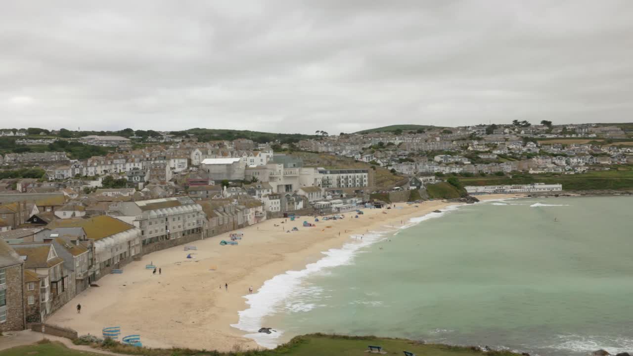 waves rolling in at high tide at Porthmeor Beach in St Ives in summer