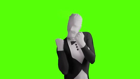 toma estática de un morphsuit de negocios jubiloso siendo feliz y alegre contra un fondo verde
