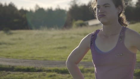 Young-Woman-Running-to-Rest-on-a-Track-at-Sunset