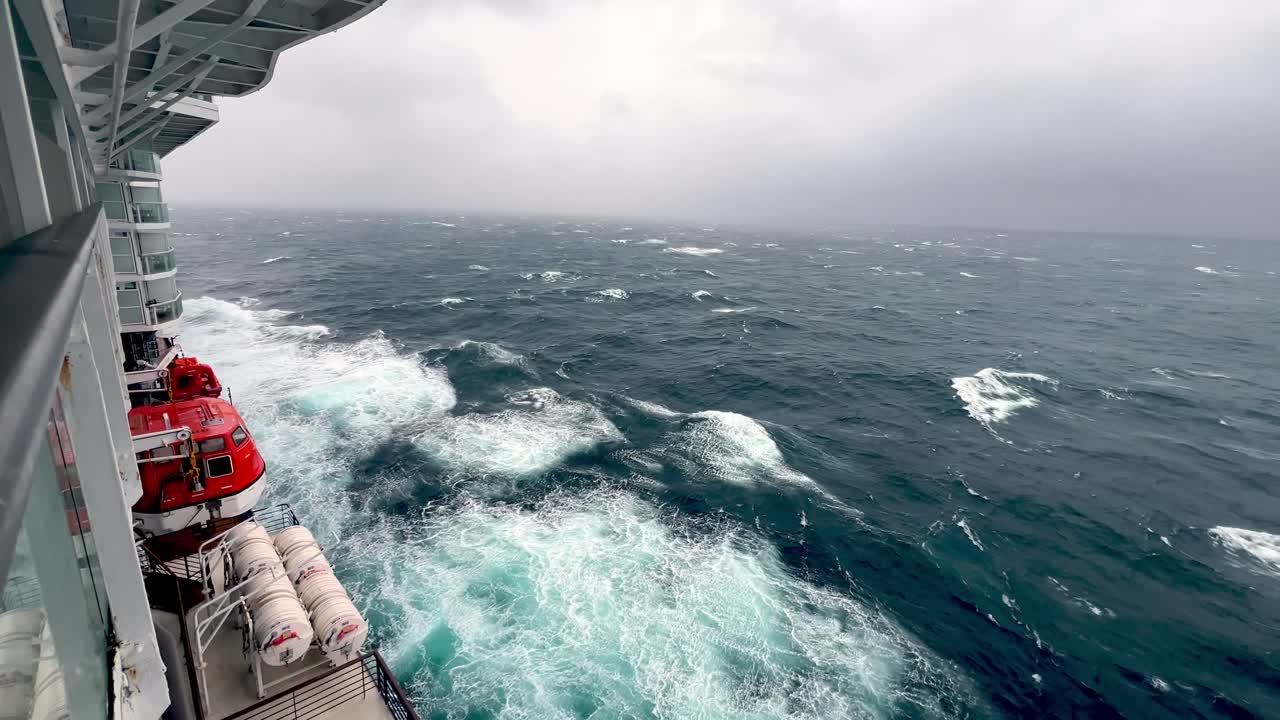 life boats on cruise ship in rough seas off the alaska coast in the bering sea