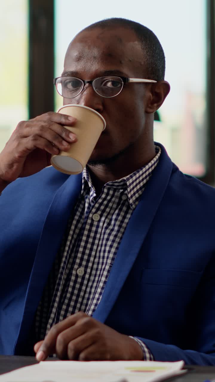 Man in blue blazer and checkered shirt