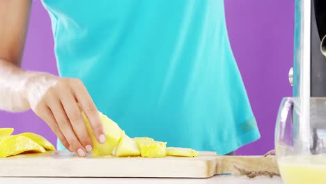 woman preparing smoothie