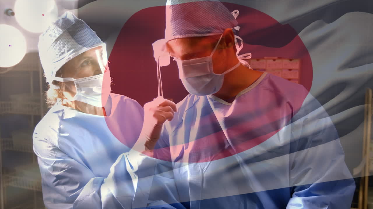 수술실 에서 외과 의사 들 위 에 흔들리는 일본 국기 의 애니메이션