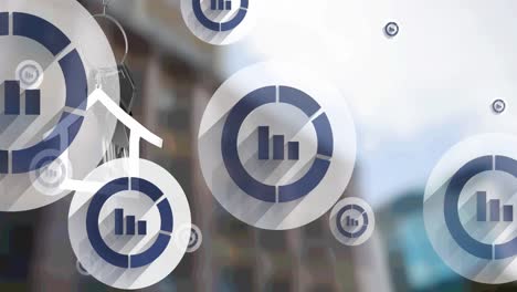 animation of bar graph icons and hanging silver house keys against blurred view of tall building