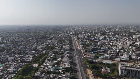 aerial view of jaipur's dense cityscape with tightly packed homes and busy streets.