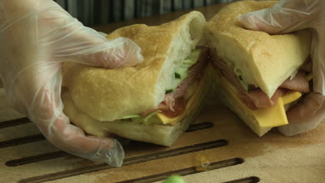 slicing a delicious sandwich into two