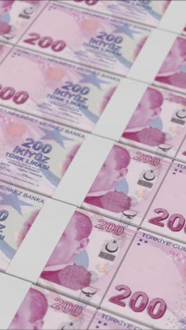 vertical video of 200 turkish lira banknotes printing by a money press