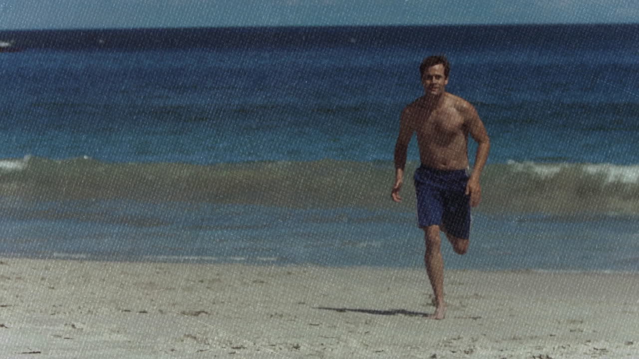 shirtless beachgoer running along sandy shoreline, showing animated fitness chart and pulse icon