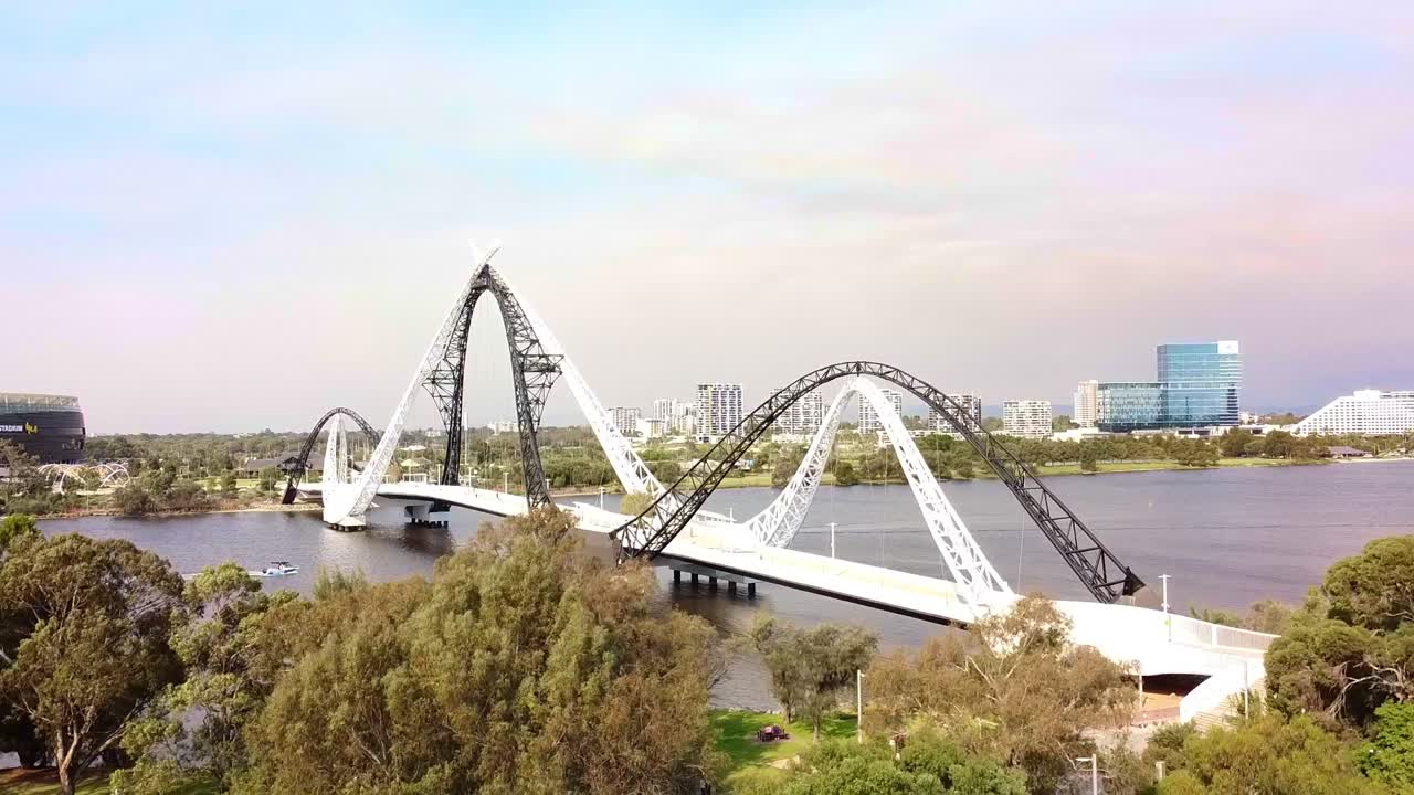 Aerial ascending view of the Matagarup pedestrian bridge over the Swan River Perth Australia