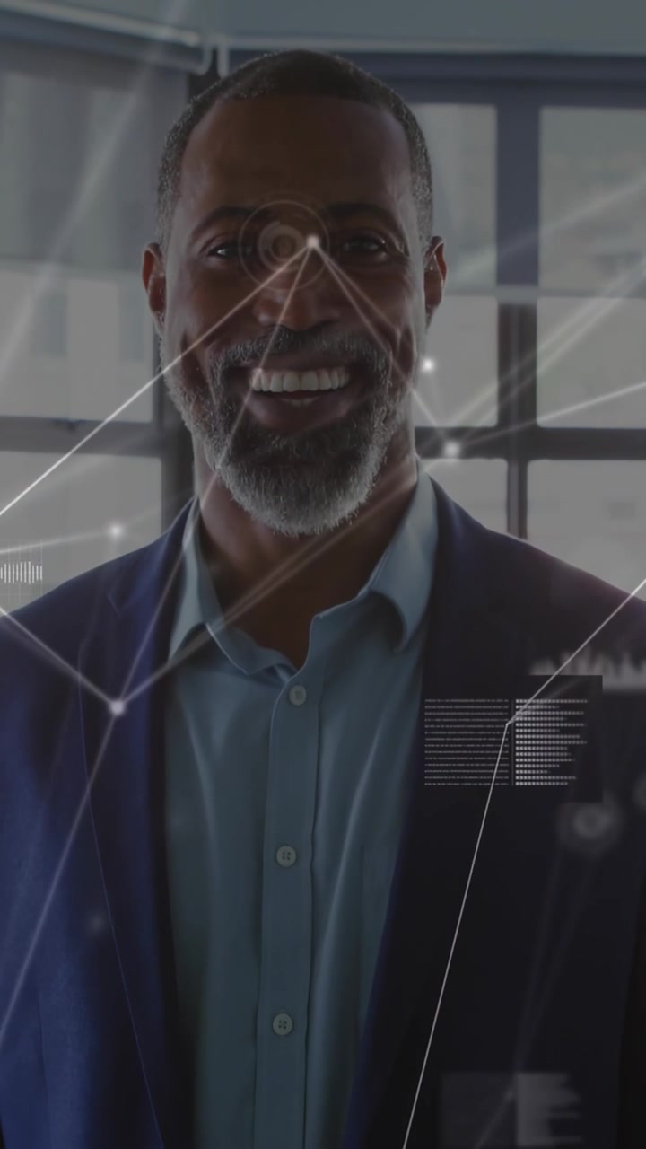 Vertical video: Mature man revealing face while camera lifting, HUD nodes overlaying face for tech