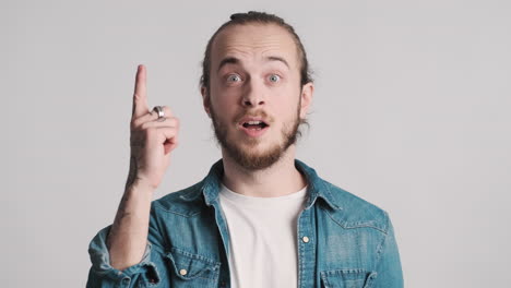 caucasian young man thinking and having an idea.