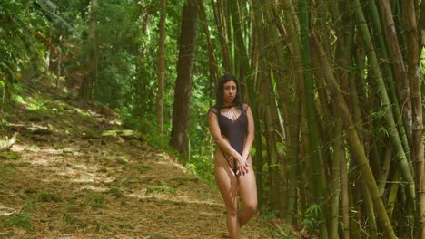 a young beauty in delicate lingerie embraces the warmth of a tropical caribbean nature walk.