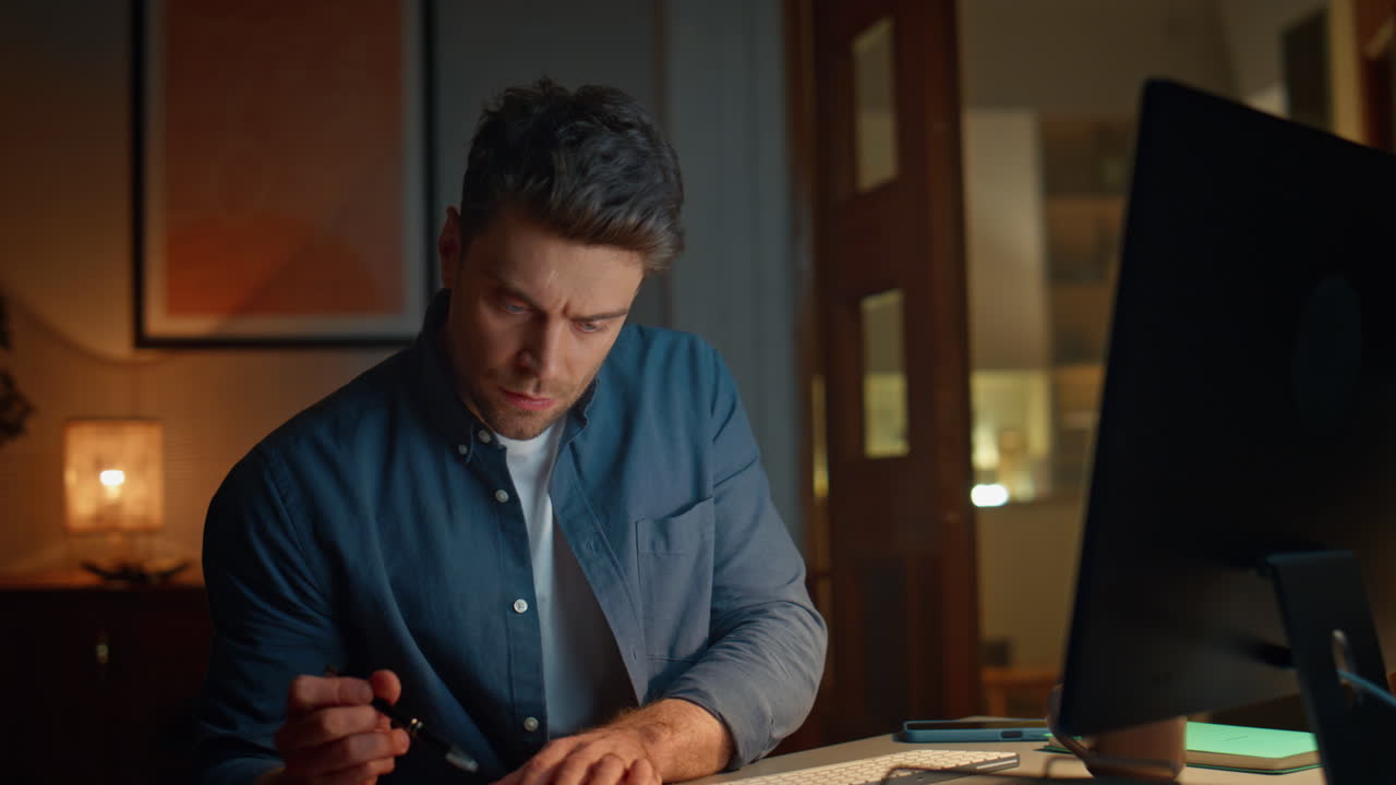 Overworked manager typing computer keyboard desk night having overtime closeup