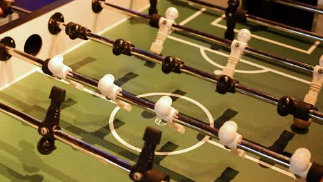 players engaged in a lively foosball match