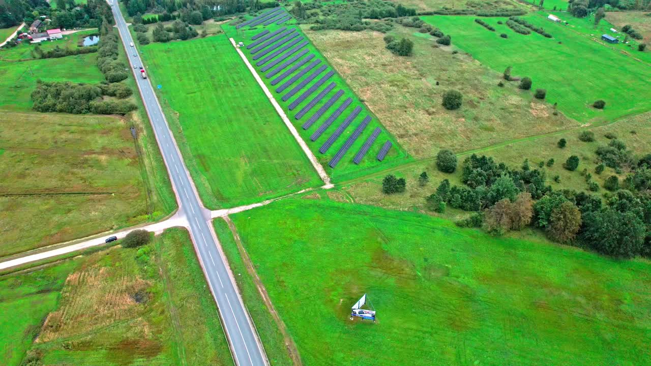 Aerial view of green fields and a highway in Latvia