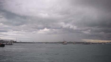 At-the-Kadıköy-pier,-in-cloudy-weather,-ships-are-sailing,-birds-are-flying,-on-the-Bosphorus