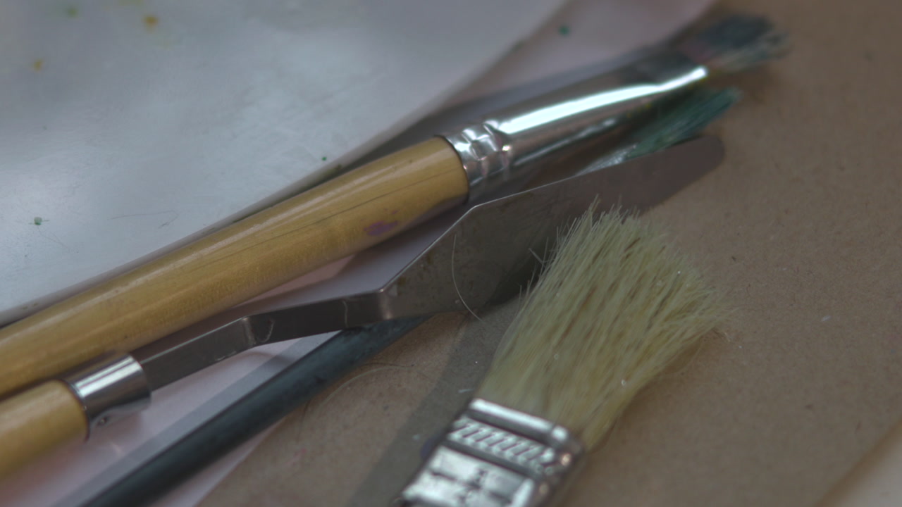 Closeup Paintbrushes On Palette Showing Bristles, Ferrules And Wooden Handles Arranged On Work Surface Gentle . Media