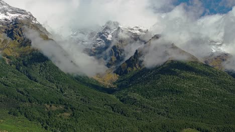 Clouds-roll-following-contours-of-steep-majestic-beech-forest-mountains-of-Glenorchy