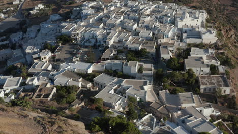 Church-in-a-Greek-Village-on-top-of-the-Hills,-Aerial-Perspective