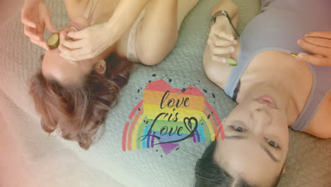 love is love text animation over two women relaxing with cucumber slices on eyes